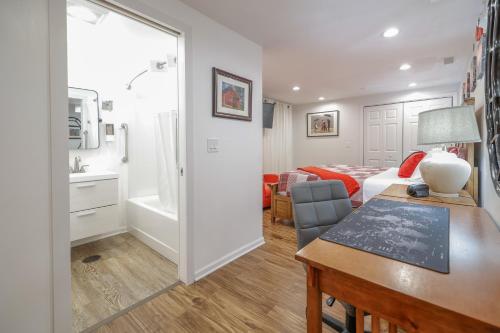 a living room with a bed and a desk in a room at Harmony Inn, Huntley Illinois in Huntley