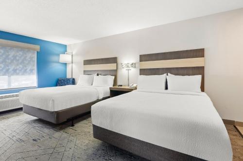 a hotel room with two beds and a window at Holiday Inn Express Princeton/I-77 by IHG in Princeton
