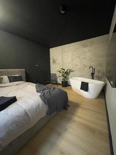 Ένα ή περισσότερα κρεβάτια σε δωμάτιο στο Apartament Imperial Przedmieście
