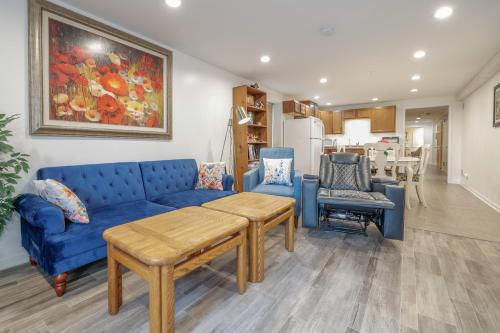 a living room with a blue couch and chairs at Harmony Inn, Huntley Illinois in Huntley