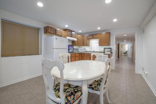 a kitchen with a white table and chairs at Harmony Inn, Huntley Illinois in Huntley