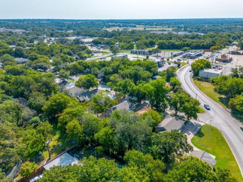 an aerial view of a town with trees and a road at NEW The Round Up, 4BR, Walk to TSU, Downtown in Stephenville