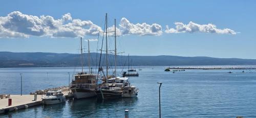 a group of boats docked at a dock in the water at Beach Side Holiday in Omiš