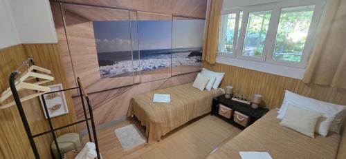 a small room with a bed and a window at Beach Side Holiday in Omiš