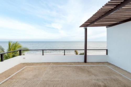a view of the ocean from the balcony of a house at The hideaway beach front villas in Ban Bo Nok