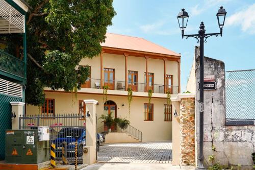 a building with a street light in front of it at AmazINN Places Casa Fortaleza in Panama City