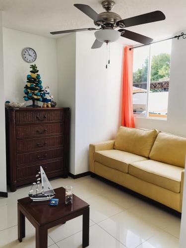 a living room with a couch and a table at Costa Linda Amazing 1-03! in Jacó