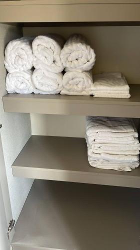 a bunch of towels are sitting on a shelf at Ventanas Del Mar - 04B-4G Oceanview in El Quindio
