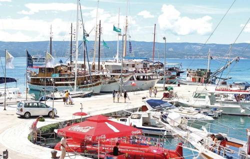 a group of boats docked at a marina at Beach Side Holiday in Omiš