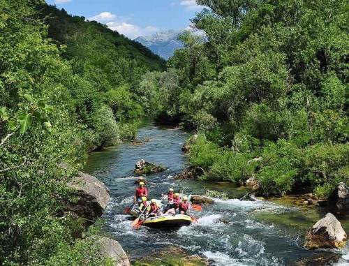 a group of people on a raft in a river at Beach Side Holiday in Omiš