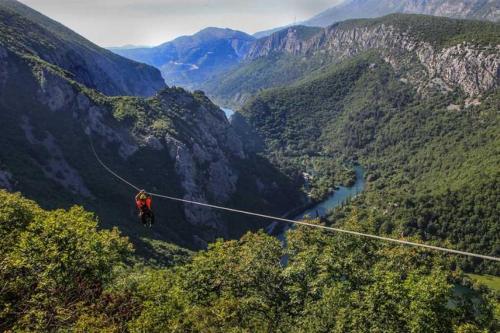 a person on a zip line in the mountains at Beach Side Holiday in Omiš