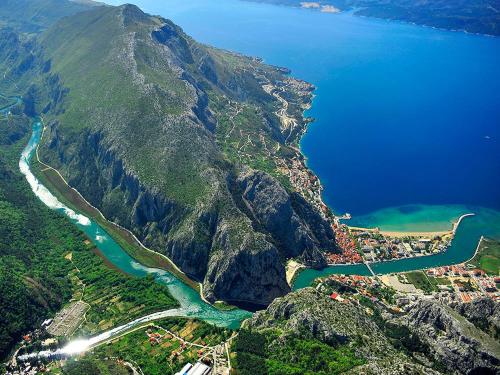 an aerial view of a mountain with a river at Beach Side Holiday in Omiš