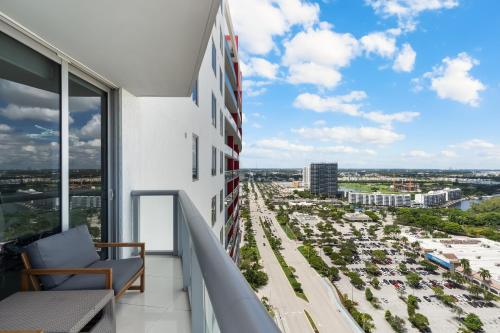 a balcony with a view of a city at Resort-Style Living with Direct Ocean Views - 3BR Beauty in Hallandale Beach