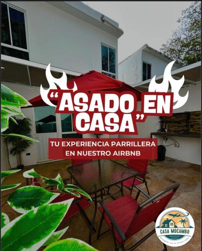 a sign for an acado en cazaza in front of a house at Sumergete Nueva Residencia en Playa del Carmen in Playa del Carmen