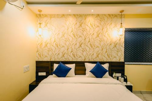 Postel nebo postele na pokoji v ubytování Livotel Premium Hotel