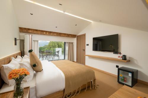 Μια τηλεόραση ή/και κέντρο ψυχαγωγίας στο Flower Hotel Jiuhuashan Blossoms Not Yet Full