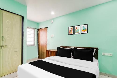 Ένα ή περισσότερα κρεβάτια σε δωμάτιο στο Hotel O Green Light Inn