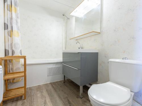 a bathroom with a toilet and a sink and a window at Appartement 8 Pers. à Peyragudes avec Piscine Intérieure - FR-1-695-86 in Germ