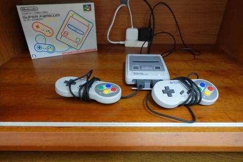 a couple of video game controllers sitting on a table at 4BR Entire House near Nikko & Highway EV Parking in Nikko