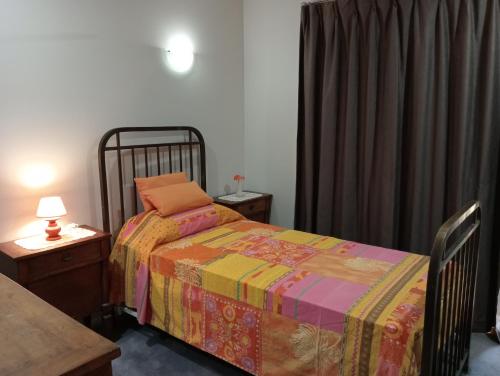 a bedroom with a bed with a colorful blanket at Lovely, bright single bedroom, private bathroom, coffee beakfast, relax, near shopping Malls in Collingwood Park