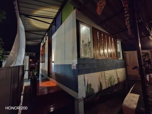 a building with paintings on the side of it at nature in Ban Rong Koet