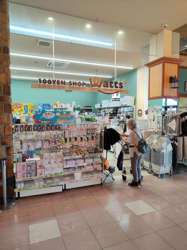 a woman is shopping in a grocery store at 4BR Entire House near Nikko & Highway EV Parking in Nikko