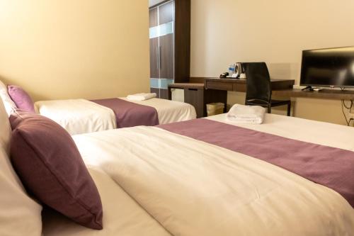 Cama o camas de una habitación en Somerset Hotel