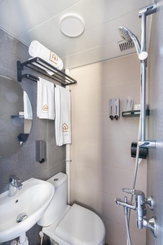 a bathroom with a toilet and a sink at Atlas Hostel & Backpackers in Hong Kong