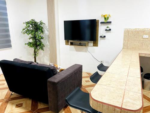 Μια τηλεόραση ή/και κέντρο ψυχαγωγίας στο Horizon House Piso 2 - Departamento