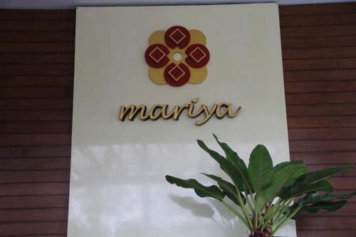 a sign for a marriott hotel on a building at Mariya Boutique Hotel At Suvarnabhumi Airport in Lat Krabang