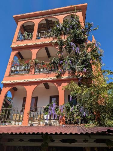 a building with flowers on the side of it at Sulawesi Castle in Rantepao
