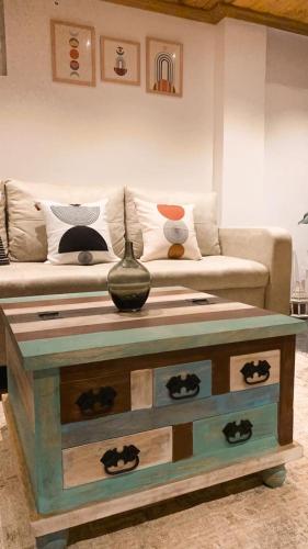 a living room with a couch and a table at Golden Rich in Gokarna