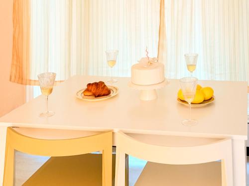a table with a cake and glasses of wine at Sum Leisure Gocheok Dome 6 minutes Emotional 4-person two-room in Seoul