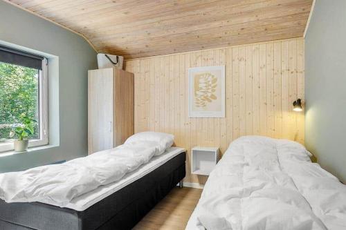 a bedroom with two beds and a window at SB53786-Aabenraa-Kloften-3 in Brøde