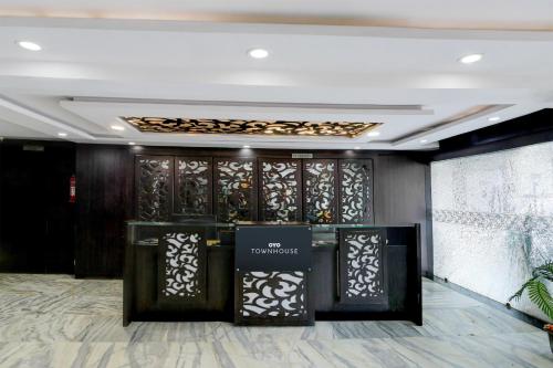 a lobby of a store with a wall of glass at Townhouse Hotel Bhopal Station Inn in Bhopal