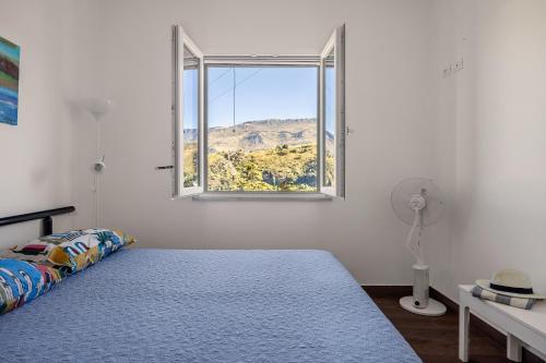 Ένα ή περισσότερα κρεβάτια σε δωμάτιο στο Luce mediterranea a Monreale