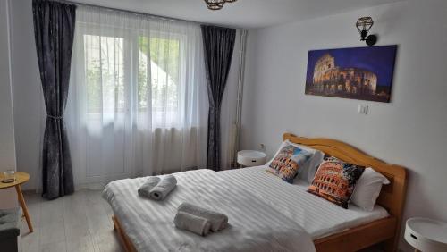 Ένα ή περισσότερα κρεβάτια σε δωμάτιο στο Casa Dobrin