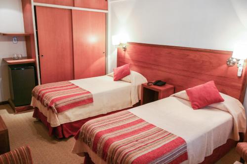 Postel nebo postele na pokoji v ubytování Apart Hotel Federación