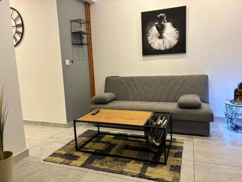 a living room with a couch and a coffee table at Chic 2-BR Loft w and Yard in Pieta