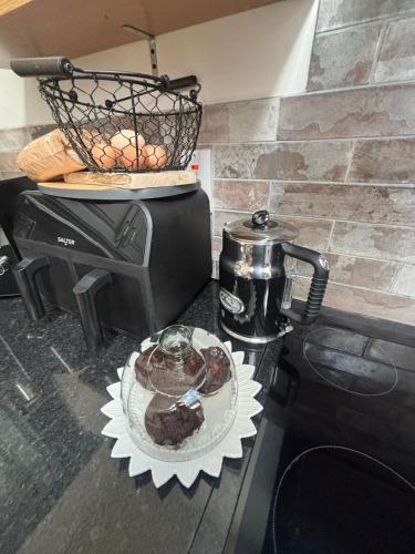 a plate of chocolate cake on top of a stove at The Old House at Belfield in Tralee