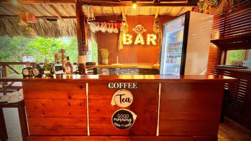 a bar with a counter with a bar sign on it at Ecohotel Yachay Dentro del Parque Tayrona Inside Tayrona Park in El Zaino