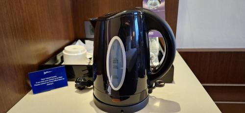 a black appliance sitting on top of a counter at Radisson Blu Hotel, Addis Ababa in Addis Ababa