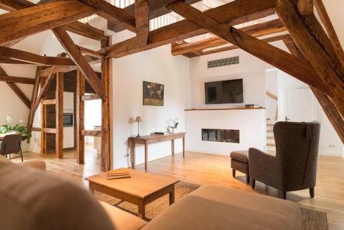 a living room with a couch and a table at Schloss Beuchow in Lübbenau