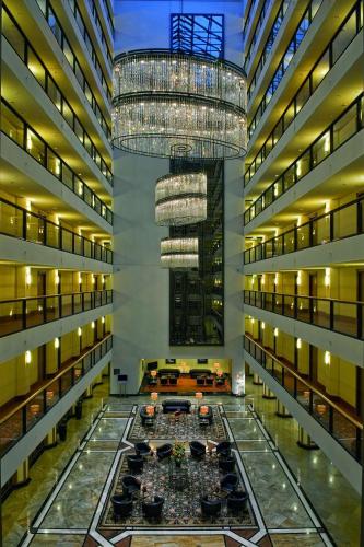 a large building with a large chandelier in the middle at Maritim Hotel Dresden in Dresden