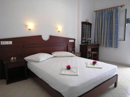 Ένα ή περισσότερα κρεβάτια σε δωμάτιο στο Elpis Rooms
