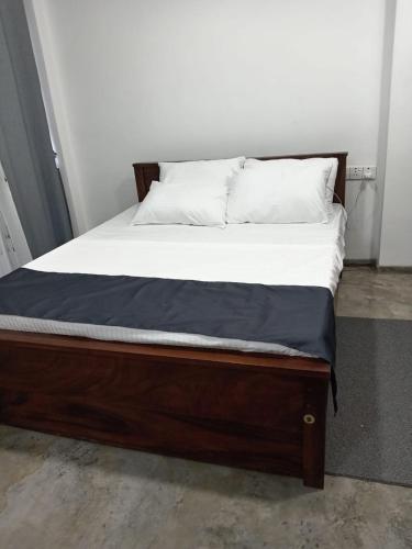 Кровать или кровати в номере Eco Bless Inn Kandy