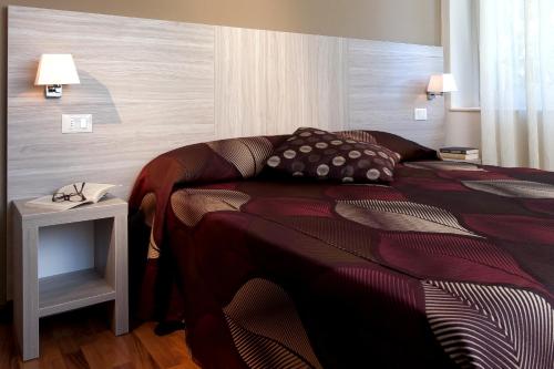 Cama ou camas em um quarto em Albergo Valentina