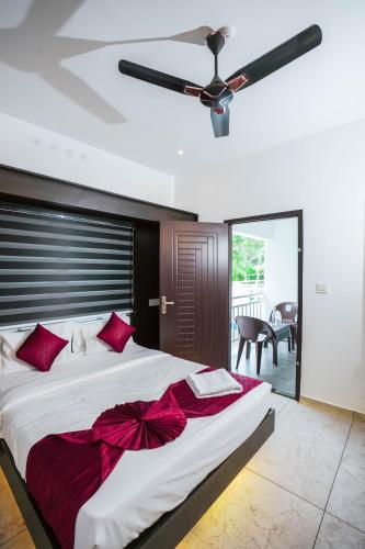 Katil atau katil-katil dalam bilik di Munnar Premium Villas