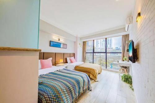 Postel nebo postele na pokoji v ubytování 落脚城市青年旅舍