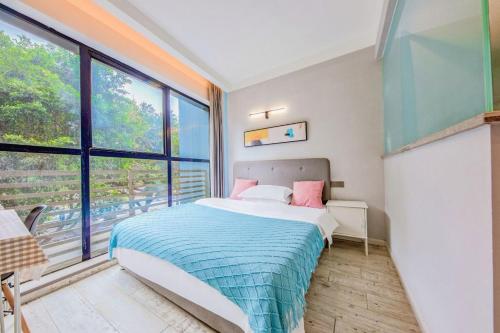 Postel nebo postele na pokoji v ubytování 落脚城市青年旅舍